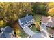 Aerial view of a home with a long drive, complemented by lush greenery and mature trees at 139 Thunder Ridge Ln, Acworth, GA 30101