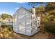 Exterior side view of a home and backyard with green space and a small deck at 139 Thunder Ridge Ln, Acworth, GA 30101