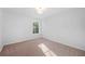 Minimalist bedroom featuring carpet flooring, a window, and neutral paint at 139 Thunder Ridge Ln, Acworth, GA 30101
