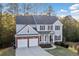Beautiful two-story home with a two-car garage, a well-maintained lawn, and established landscaping at 139 Thunder Ridge Ln, Acworth, GA 30101