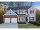 Charming two-story home with a two-car garage, complemented by a well-manicured lawn and garden at 139 Thunder Ridge Ln, Acworth, GA 30101