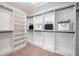 Spacious walk-in closet with ample shelving and hanging space; ready for organization at 139 Thunder Ridge Ln, Acworth, GA 30101