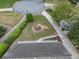 Bird's eye view of well manicured backyard featuring lush hedges, manicured lawn, flowering bushes, and mature tree at 1606 Nuthatch Ct, Marietta, GA 30062