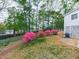 Backyard featuring a lush lawn and colorful flowering azaleas, great for curb appeal at 1606 Nuthatch Ct, Marietta, GA 30062