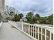 Long balcony showing other homes in the neighborhood and a white railing at 1606 Nuthatch Ct, Marietta, GA 30062