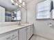 Bathroom with large mirror, a window, and a shower with blue curtain at 1606 Nuthatch Ct, Marietta, GA 30062