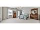 Spacious bedroom with neutral carpet and two windows for plenty of light at 1606 Nuthatch Ct, Marietta, GA 30062