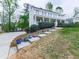 Two-story home with a long driveway and colorful planters lining the walkway at 1606 Nuthatch Ct, Marietta, GA 30062