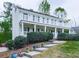 Charming two-story home with a front porch, a second story balcony, and landscaped front yard at 1606 Nuthatch Ct, Marietta, GA 30062