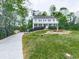 Well-manicured lawn featuring a decorative fountain and beautiful landscape at 1606 Nuthatch Ct, Marietta, GA 30062