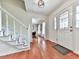 Foyer boasts hardwood floors, a staircase, and a front door with a decorative glass insert at 1606 Nuthatch Ct, Marietta, GA 30062