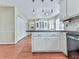 Spacious kitchen features dark countertops and pendant lighting at 1606 Nuthatch Ct, Marietta, GA 30062