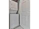 Convenient laundry area with a stacked washer and dryer unit at 1606 Nuthatch Ct, Marietta, GA 30062