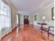 Bright living room with hardwood floors, windows with natural light, and neutral walls at 1606 Nuthatch Ct, Marietta, GA 30062