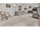 Cozy living room with a fireplace, built-in shelves, carpet flooring, and comfortable seating at 1606 Nuthatch Ct, Marietta, GA 30062