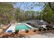 Community pool and recreational area featuring a playground, tennis court, and landscaping at 1606 Nuthatch Ct, Marietta, GA 30062