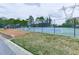 A well-maintained community tennis court surrounded by lush greenery at 1606 Nuthatch Ct, Marietta, GA 30062