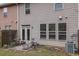 The property includes a small patio and manageable backyard at 587 Jody Pl, Lilburn, GA 30047