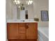Modern bathroom with a large vanity, double sinks and soaking tub at 587 Jody Pl, Lilburn, GA 30047