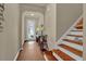 Entryway with hardwood floors and access to the staircase and a view of the front door at 587 Jody Pl, Lilburn, GA 30047