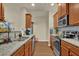 Well-lit kitchen with stainless steel appliances and granite countertops at 587 Jody Pl, Lilburn, GA 30047