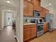 Well-equipped kitchen with stainless steel appliances and functional layout at 587 Jody Pl, Lilburn, GA 30047