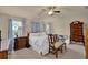 Spacious bedroom with neutral walls, ceiling fan, and wooden furnishings with great natural light at 587 Jody Pl, Lilburn, GA 30047