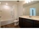 Bathroom featuring a tub-shower combination, a dark wood vanity, and a white countertop at 1837 Millstream Holw, Conyers, GA 30012