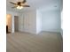 Bright main bedroom boasts a ceiling fan and double closets for ample storage at 1837 Millstream Holw, Conyers, GA 30012