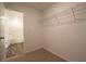 Spacious walk-in closet featuring carpeted floors and a wire shelving unit for easy organization at 1837 Millstream Holw, Conyers, GA 30012