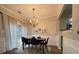 Dining room with modern chandelier and access to a backyard sliding glass door at 2692 Briaroak Dr, Duluth, GA 30096