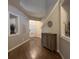 Inviting entryway featuring hardwood floors, neutral paint, and built-in display shelves at 2692 Briaroak Dr, Duluth, GA 30096