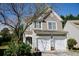 Charming two-story home featuring a two-car garage and landscaped front yard at 2692 Briaroak Dr, Duluth, GA 30096