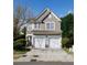 Charming two-story home featuring a two-car garage and landscaped front yard at 2692 Briaroak Dr, Duluth, GA 30096