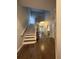 Inviting foyer with hardwood floors, staircase, and views into the living spaces at 2692 Briaroak Dr, Duluth, GA 30096