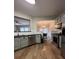Kitchen featuring stainless steel appliances, wood floors, and pastel-colored cabinets at 2692 Briaroak Dr, Duluth, GA 30096