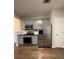 Kitchen featuring stainless steel appliances, wood floors, and pastel-colored cabinets at 2692 Briaroak Dr, Duluth, GA 30096