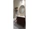 Stylish powder room with patterned floors, a vanity, and decorative floating shelves at 2692 Briaroak Dr, Duluth, GA 30096