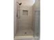 Modern shower featuring stone tile and glass door at 2692 Briaroak Dr, Duluth, GA 30096