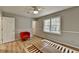This is a bedroom with gray walls and wood-look floors, and a window view at 3081 Frankie Ln, Duluth, GA 30096