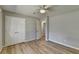 Bedroom with updated light-colored floors, a ceiling fan, and a closet at 3081 Frankie Ln, Duluth, GA 30096