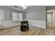 Dining room with wood floors, wainscoting and an adjacent entry at 3081 Frankie Ln, Duluth, GA 30096
