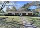 Attractive ranch home with red shutters and a well-landscaped front yard at 3081 Frankie Ln, Duluth, GA 30096