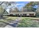 Neat single-story home with red shutters and a spacious front lawn at 3081 Frankie Ln, Duluth, GA 30096