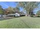 Scenic view of a ranch home with carport and sprawling green lawn at 3081 Frankie Ln, Duluth, GA 30096