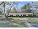 Well-maintained ranch home with red shutters and a manicured front lawn at 3081 Frankie Ln, Duluth, GA 30096