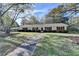 Classic ranch home with red shutters, carport and well-kept lawn at 3081 Frankie Ln, Duluth, GA 30096
