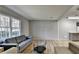 Bright living room with large window, wood floors, and comfortable couches at 3081 Frankie Ln, Duluth, GA 30096