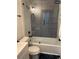 Stylish bathroom featuring patterned tile shower, modern fixtures, and glass door at 609 Spring St, Atlanta, GA 30354