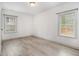 Bright bedroom featuring wood-look flooring and two windows that provide plenty of natural light at 609 Spring St, Atlanta, GA 30354